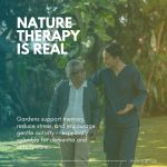 ACGM staff walking with elderly residents through a freshly maintained aged care garden